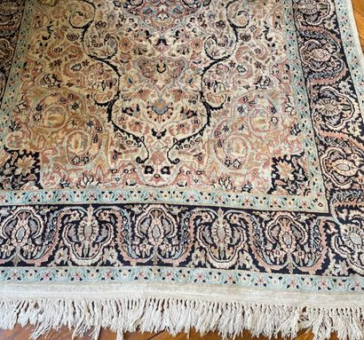 null Two woolen carpets, one with geometrical decoration of central medallion and...