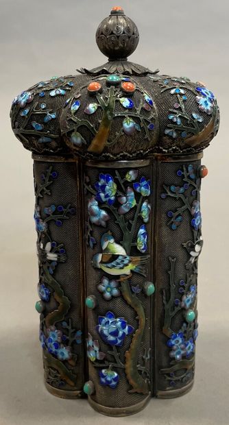 null A silver and niello covered pot with enamelled birds on a metal core.

China...