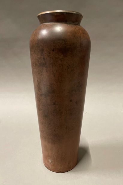 Bronze vase with a shaded red patina. 
Surrounded...