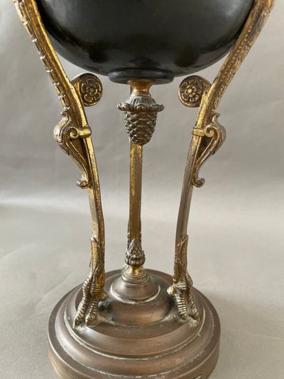 null An Athenian ormolu lamp stand with chased heads and feet of birds of prey and...