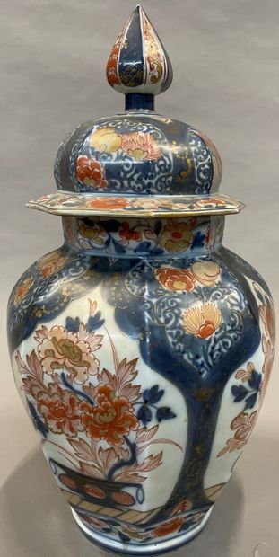 null A porcelain baluster-shaped covered vase with cut sides and Imari decoration.

H....