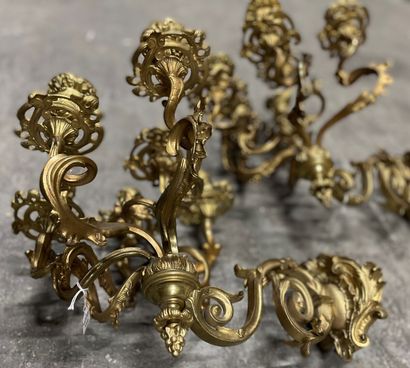 null A pair of ormolu sconces with six scrolled lights and openwork foliage.

Middle...