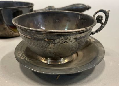 null Silver lot including: two cups and saucers, a small saucepan with wooden handle...