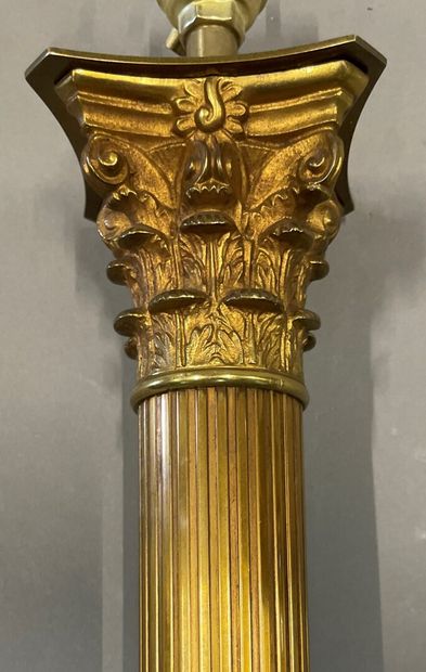 null A gilt bronze and chased lamp stand on a square base, fluted shaft, Corinthian...