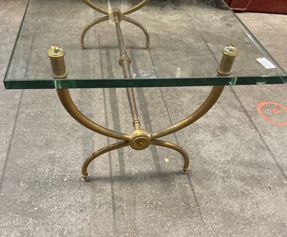 null Coffee table with glass top and gilt bronze base. 

Circa 1970.

42 x 100 x...