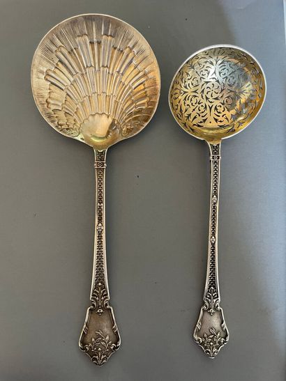 null Silver sprinkling spoon and ice-cream scoop with scale decoration.

Minerva...