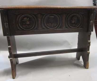 Bench in stained walnut with carved profiles....
