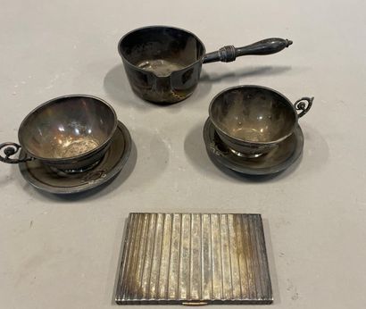  Silver lot including: two cups and saucers, a small saucepan with wooden handle...