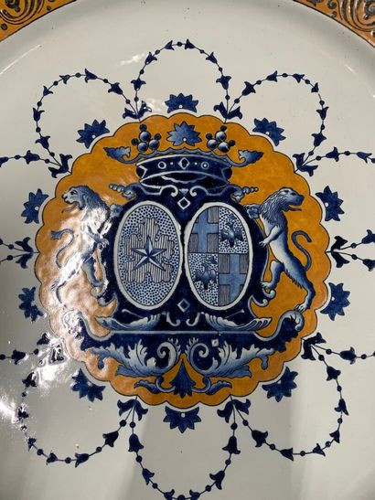 null Earthenware dish, decorated with coats of arms under a marquis crown, the wing...