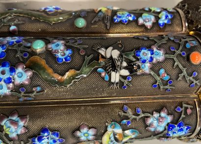 null A silver and niello covered pot with enamelled birds on a metal core.

China...