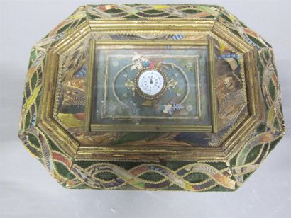 null Octagonal box in applied fabric on a green velvet background with feather inlay...