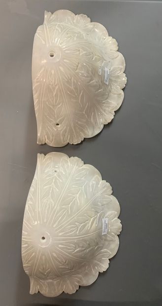 null Pair of wall sconces in alabaster carved with foliage composed of two vases,...