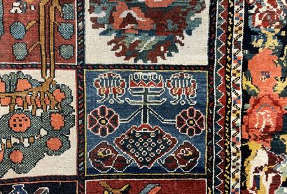 null Small Persian carpet, wool, the field with boxes and stylized flowers. 

First...