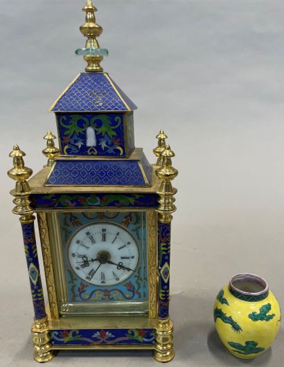A gilt metal and porcelain plate table clock...