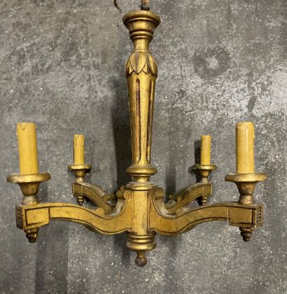null 
A giltwood chandelier with four lights, the shaft tapered and fluted.

Height...