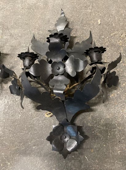 null 
Pair of black patina wrought iron sconces with three lights and stylized flowers.

H...