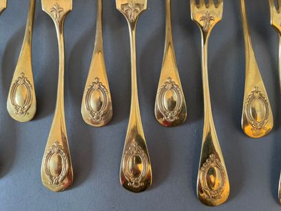 null A lot including :

Six gilded metal flatware, the handle decorated with a medallion

A...