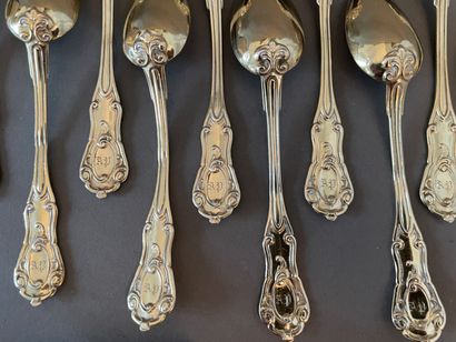 null Twelve coffee spoons and one sugar tongs in vermeil, the handle with rocaille...