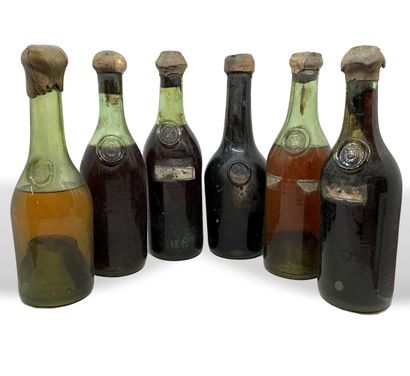  12 bouteilles d'alcools non identifiées (sauf 1 eau de vie de 1914) bouteilles soufflées...
