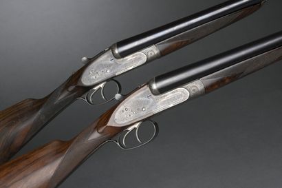 null 
Paire de fusils juxtaposés à platines Henry Atkin, calibre 12 (n°2661 et 2662)....