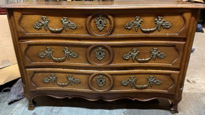 null Molded walnut chest of drawers, the front opening to three drawers, the top...