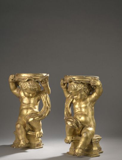 null 
*Italy, 19th century.




Pair of gilded wood saddles each formed by a putto.




H...