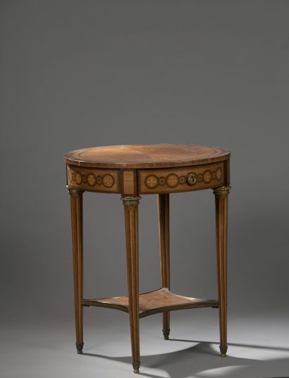 null Pedestal table in rosewood veneer inlaid with interlacing with a drawer in the...