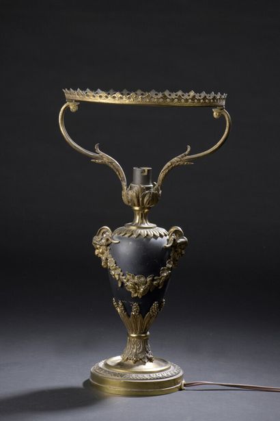 null 
Lamp stand with ovoid body decorated with leaves and a garland of flowers in...