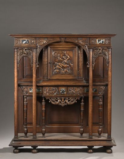 null Natural walnut cabinet with a portico front, the center formed by a full arch...