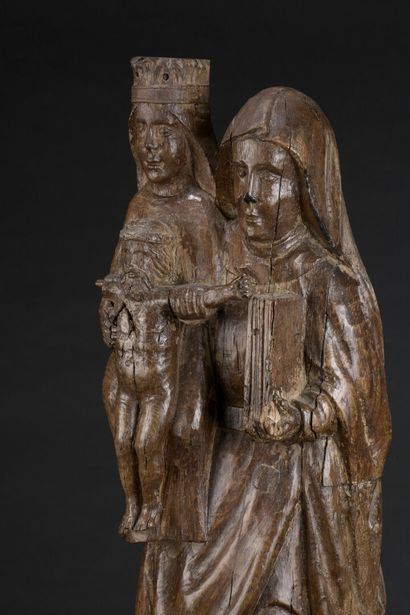 null 
*Saint Anne Trinitarian in carved oak. Standing, Saint Anne carries on her...