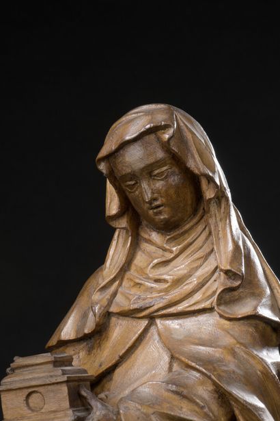 null 
*St. Clare in basswood carved with minor traces of polychromy and gilding,...