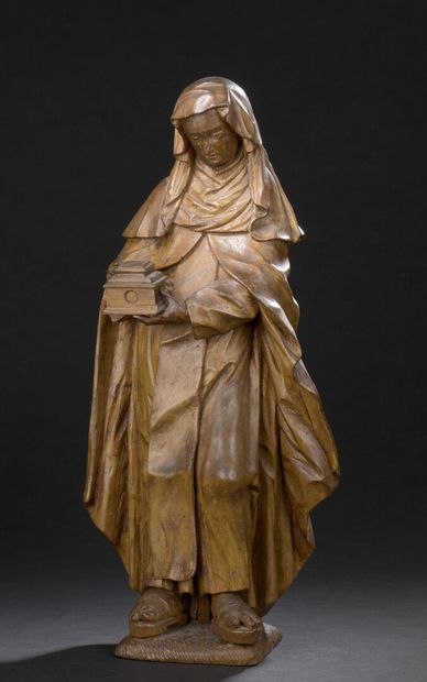 null 
*St. Clare in basswood carved with minor traces of polychromy and gilding,...