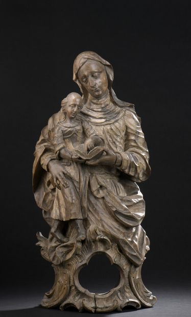 null 
*Reliquary statue of St. Anne educator in carved wood with traces of polychromy....