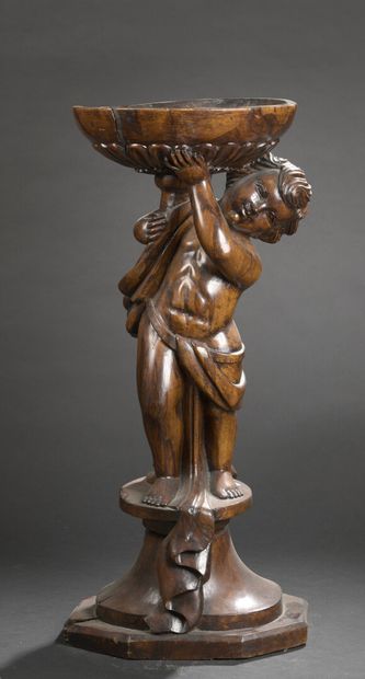 null 
*Sellette wood carved with a child supporting a basin and resting on a pedestal...