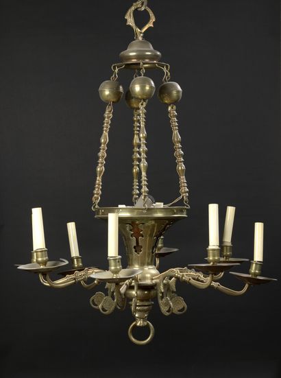 null Brass chandelier, the shaft in the shape of a horn held by four chains of baluster...