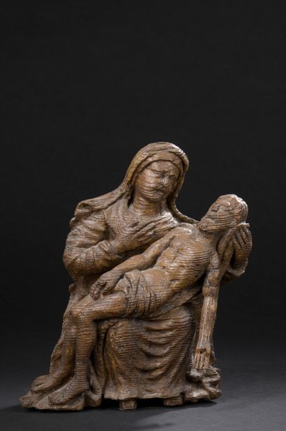 null 
*Virgin of Pity in carved oak. The seated Virgin is holding her right hand...