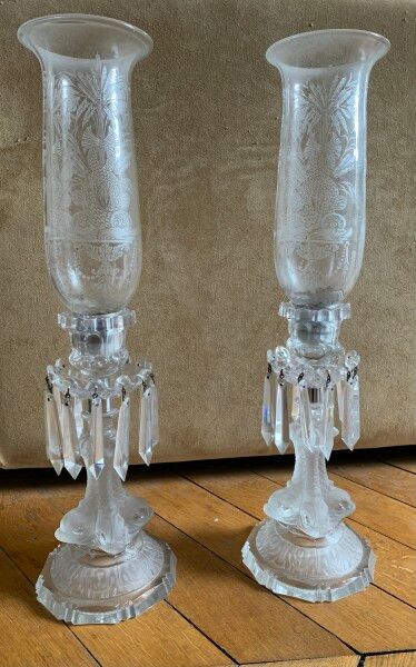 null Manufacture of Saint-Louis

Two glass candle holders with engraved decoration,...