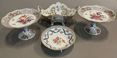null A Dresden openwork porcelain basket, two display stands and a cup with flowers.

19th...
