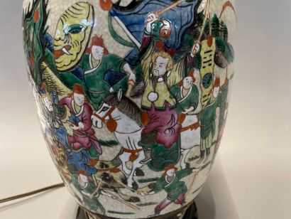 null A Nanjing porcelain baluster vase with a battle scene on a cracked background...