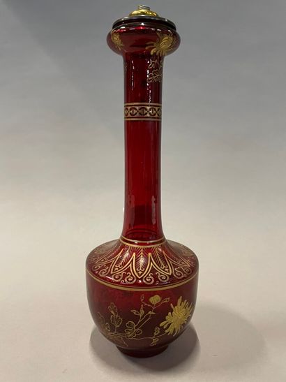 null A red glass baluster vase with peonies in gilding in the Chinese style attributed...