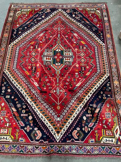 null 
Iranian wool carpet with a beige background decorated with a central medallion.

145...
