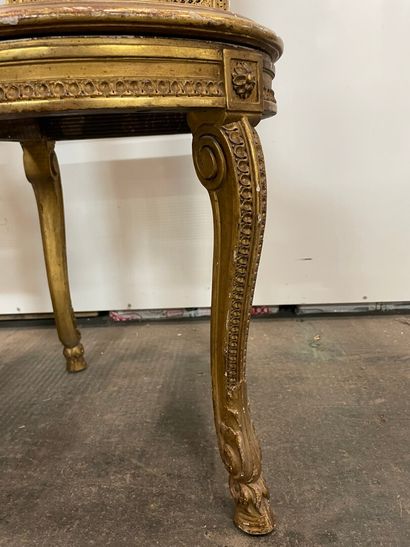null Two gilded wood chairs carved with leaves, cane seats and back, console legs...