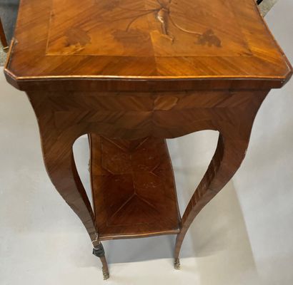 null Small veneer coffee table opening to a drawer in belt, cambered legs, the top...