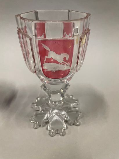 null Hexagonal footed glass decorated with horses on a red background, the base of...