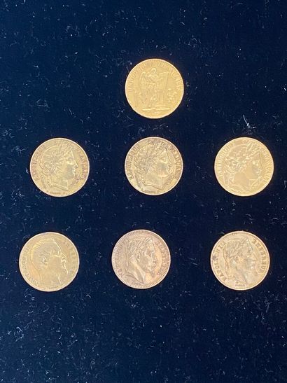 null 
FRANCE 




7 monnaies de 20 francs en or, Génie de la République rédigeant...