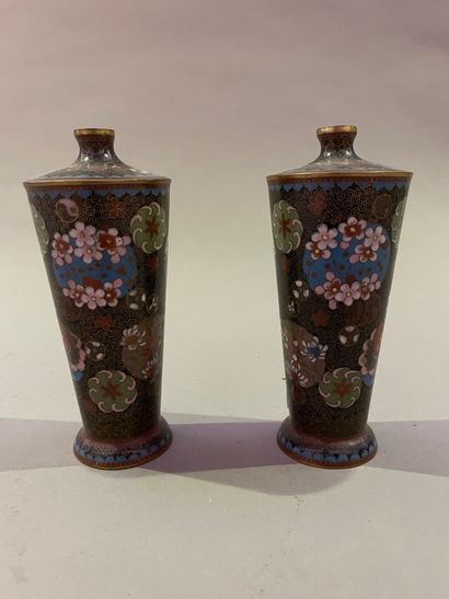 null A pair of small narrow-necked bronze vases with cloisonné enamel decoration.

Japan,...