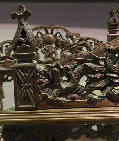 null Three carved exotic wood corner tables, decorated with dragons looking for the...