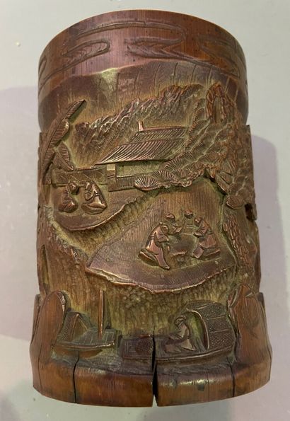 null Carved bamboo brush pot, decorated with an animated landscape of characters

China,...