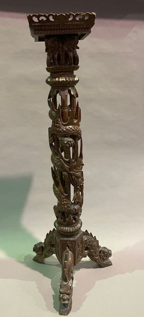 null Exotic wood stand carved with dragons and elephants on a tripod base.

End of...
