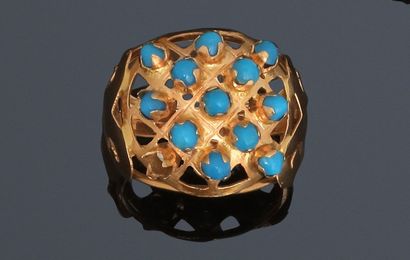 Yellow gold dome ring paved with glass cabochons...